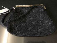 An early/mid twentieth century black beaded evening bag