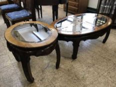 An oriental style glass topped coffee table together with matching lamp table