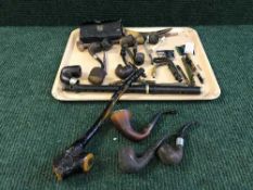 A tray of vintage pipes, leather cased gent's travel set, medal ribbons,