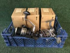 A box of three WITE fixed spool spinning reels together with two unboxed spinning reels