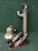 A basket containing two hand wood working planes together with a brass bell and vintage brass hand