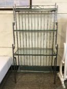 A heavy metal four tier baker's rack