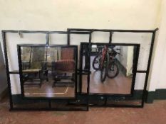 Two large metal framed shop wall mirrors