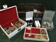 A basket of costume jewellery together with a basket of assorted brass and plated items