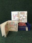 Four stamp albums containing stamps of the world (4)