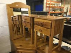 A pair of pine two drawer bedside chests together with pine wall mirror