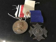 A nursing medal with ribbon together with a special constable medal with ribbon
