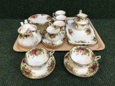 A tray of twenty four pieces of Royal Albert old country roses tea china