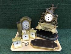 A tray of continental brass and marble mantle clock with key, four battery powered clocks,