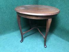 An early twentieth century mahogany circular occasional table