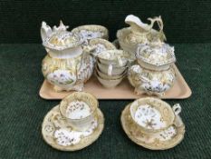 A tray of thirty piece Victorian cream and gilt tea service