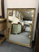 An ornately framed gilt mirror