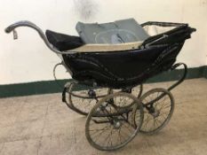 A mid twentieth century silver cross full suspension pram with canopy and extra boxed Morlands