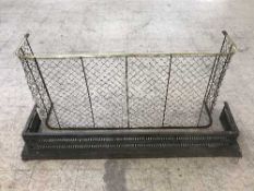 An antique brass framed fire guard together with a metal fire curb