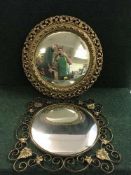 A circular gilt framed porthole mirror together with a brass framed mirror