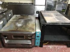 A commercial Cuppone stainless steel pizza oven on two-tier table