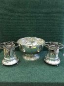 A large plated punch bowl together with two plated food warmers