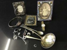 A Georgian silver soup ladle, a Victorian deguerreotype, a mosaic photograph frame,