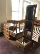A pine four drawer chest together with matching bedside stand, cheval mirror,
