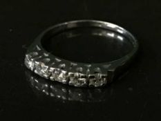 An 18ct white gold five stone diamond ring