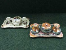 Two Maling four piece trinket sets