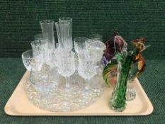 A tray of assorted glass ware, champagne flutes, glass bell,