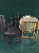 A folding oak brass topped table together with an oak rush seated stool,