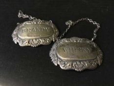 Two silver decanter labels,