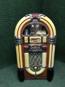 A contemporary Wurlitzer style juke box with cd player