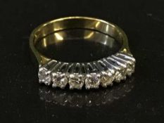 An 18ct gold seven stone diamond ring, approx 0.