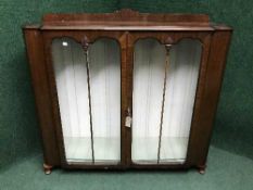 A mahogany Queen Anne style double door display cabinet