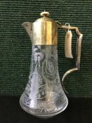 An etched glass and silver plated claret jug together with a Nao figure of a swan and small plated