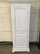 A contemporary white country corner sentry door wardrobe