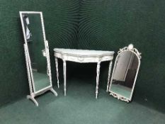 A cream and gilt glass topped hall table with matching hall mirror and cheval mirror