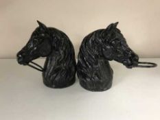 Two cast metal horse heads