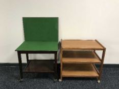 A late twentieth century teak three tier trolley with mahogany turn over top card table