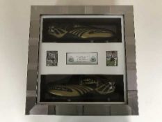A pair of cased Umbro football boots signed by Peter Beardsley