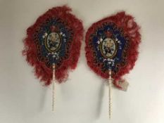A pair of ivory handled beaded hand fans
