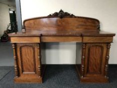 A Victorian mahogany pedestal sideboard