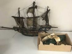 A malachite boat with bone fittings and another boat model