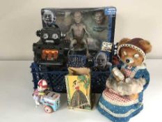 A basket of mid 20th century tin plate toys including an ice cream salesman, Shucho Examico 4001,