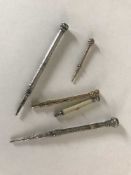 Two gold pencils, two silver pencils and a silver and bone pencil marked Mordan & Co.