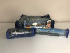 A box of eight assorted boxed model ships