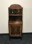 A Victorian inlaid mahogany cabinet