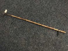 An early 20th century bamboo litter picker