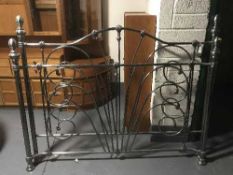 A pair of chrome metal headboards