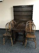 An eight piece Jaycee Oak dining room suite (dresser,