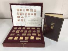 A cased silver proof stamp set: The Empire Collection, 25 gold-plated silver ingots,
