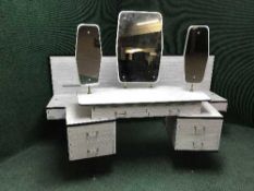 A mid century Formica continental headboard and matching dressing table