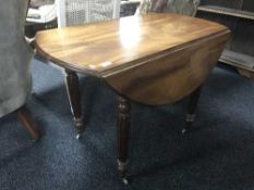 A Victorian mahogany drop leaf table